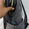 2026/10/1000786607.jpg mochila pañalera multifuncional de color gris melange con detalles dorados y cambiador portatil