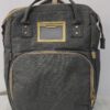 2026/10/1000786633.jpg mochila pañalera multifuncional de color gris melange con detalles dorados y cambiador portatil