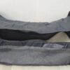 2026/10/1000786670-1.jpg mochila pañalera multifuncional de color gris melange con detalles dorados y un compartimento frontal y cambiador portátil